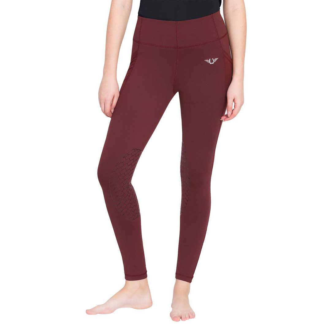 Maroon leggings worn by a person on a white background