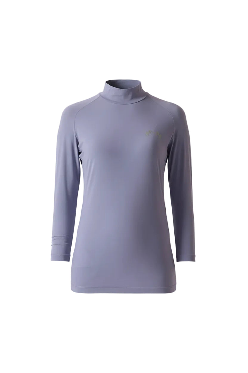 Woman wearing a light purple long-sleeve top against a plain background