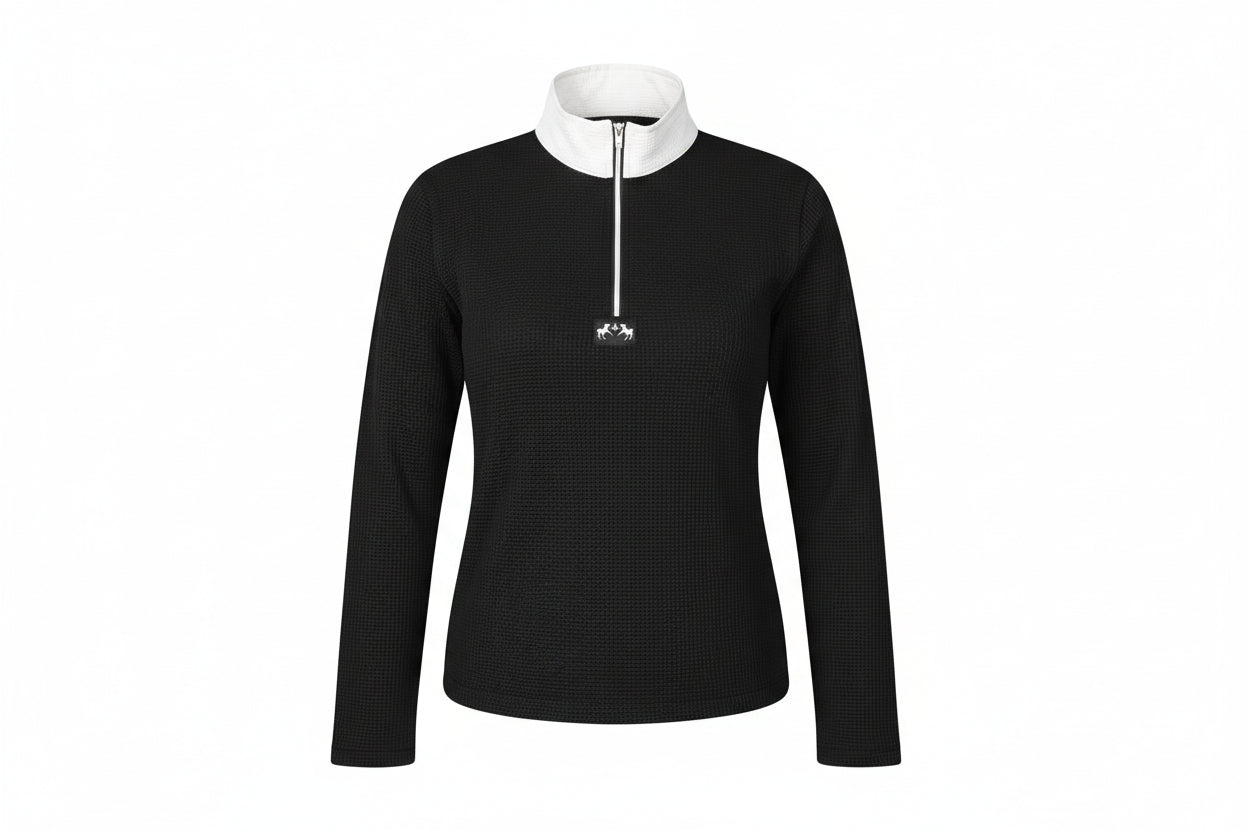 Person wearing a black long-sleeve shirt with a white collar and zipper, standing against a white background.