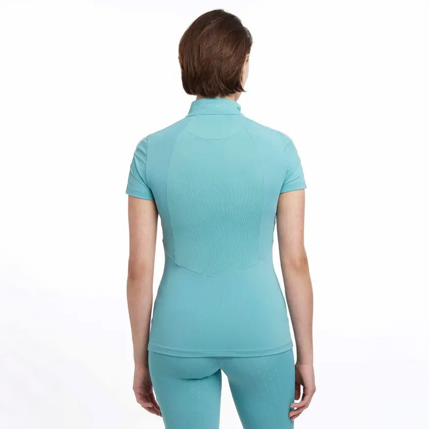 Woman wearing a teal athletic outfit on a white background