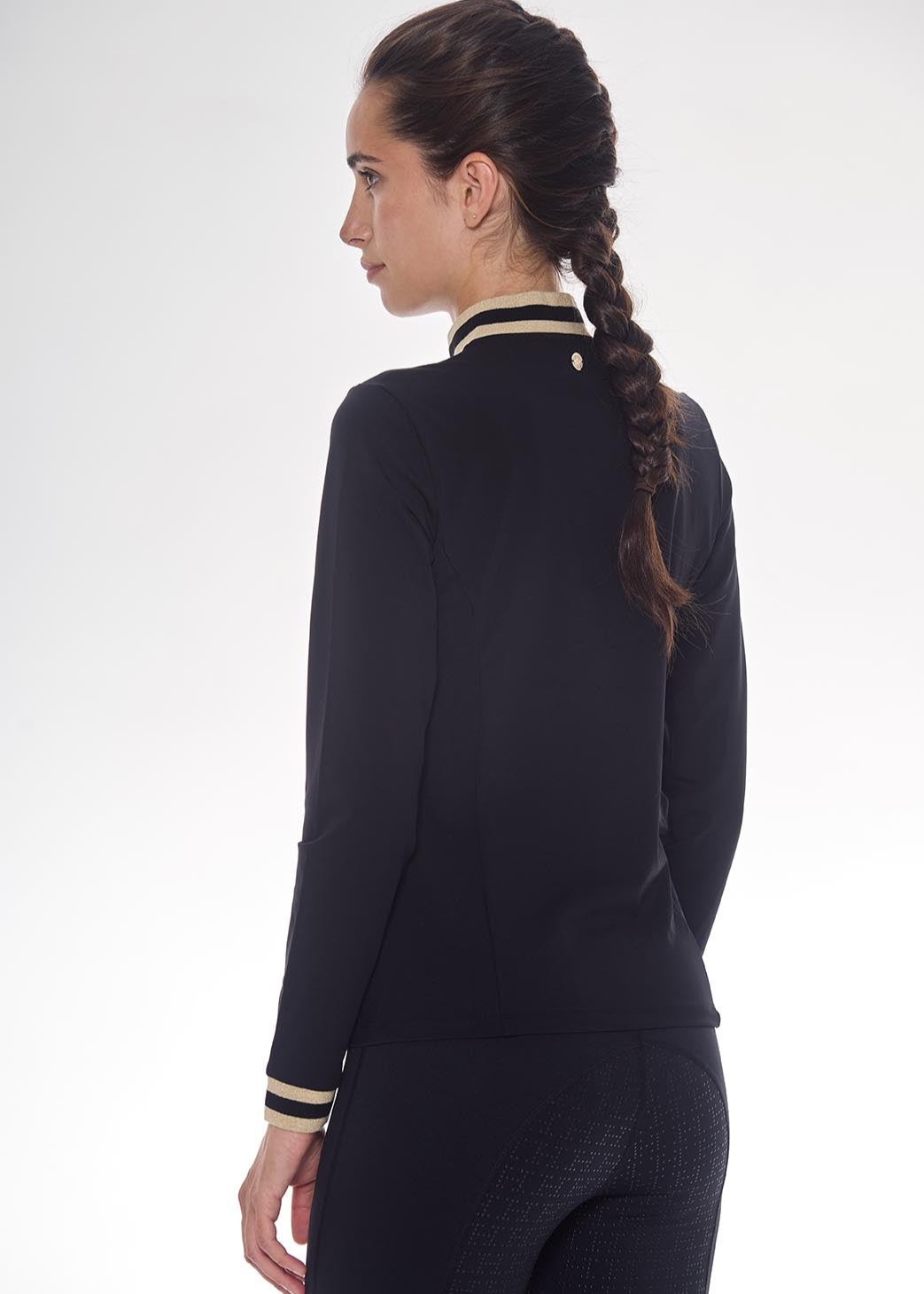 Person wearing a black outfit with a white background