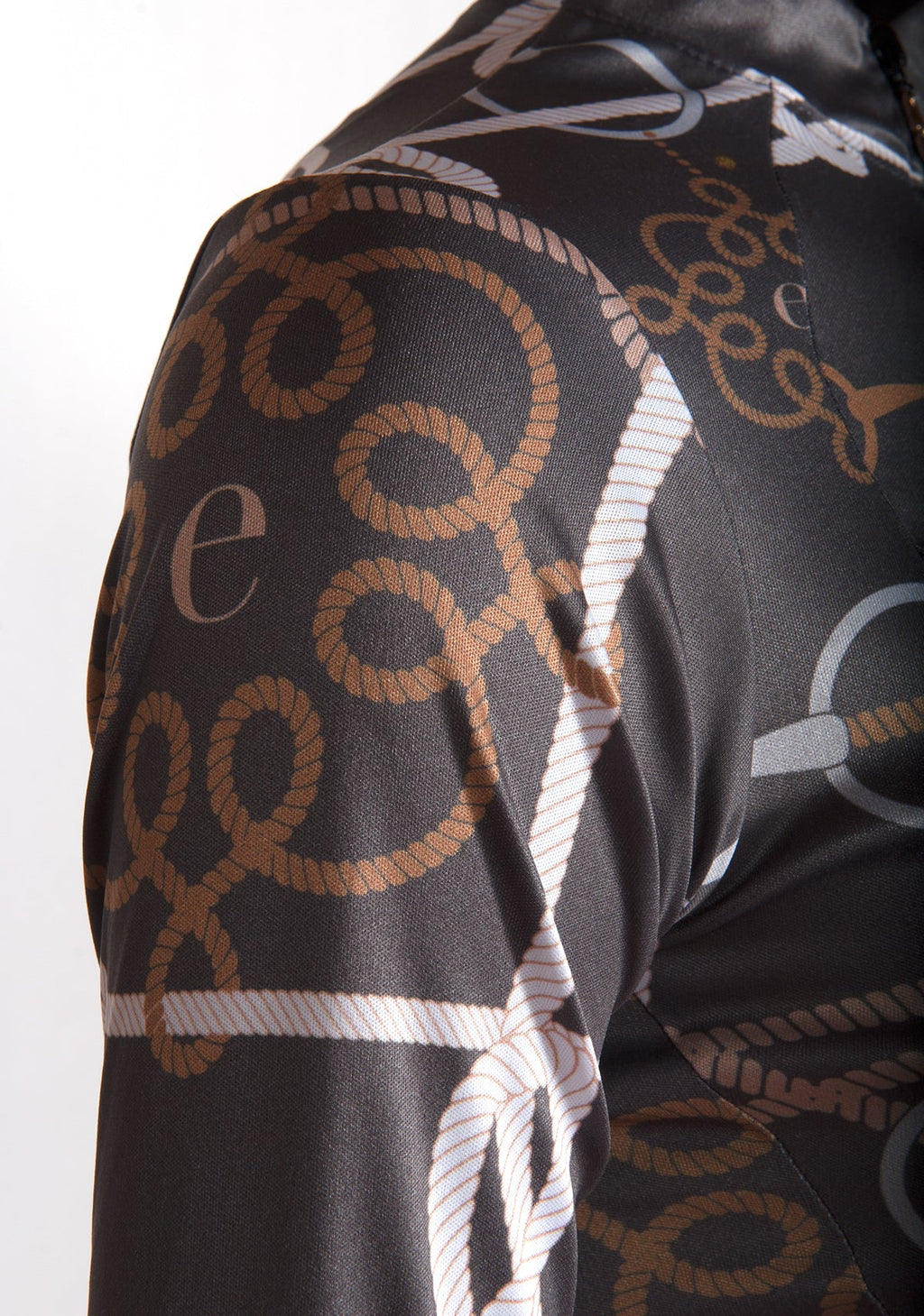 Close-up of a patterned fabric with rope designs on a white background