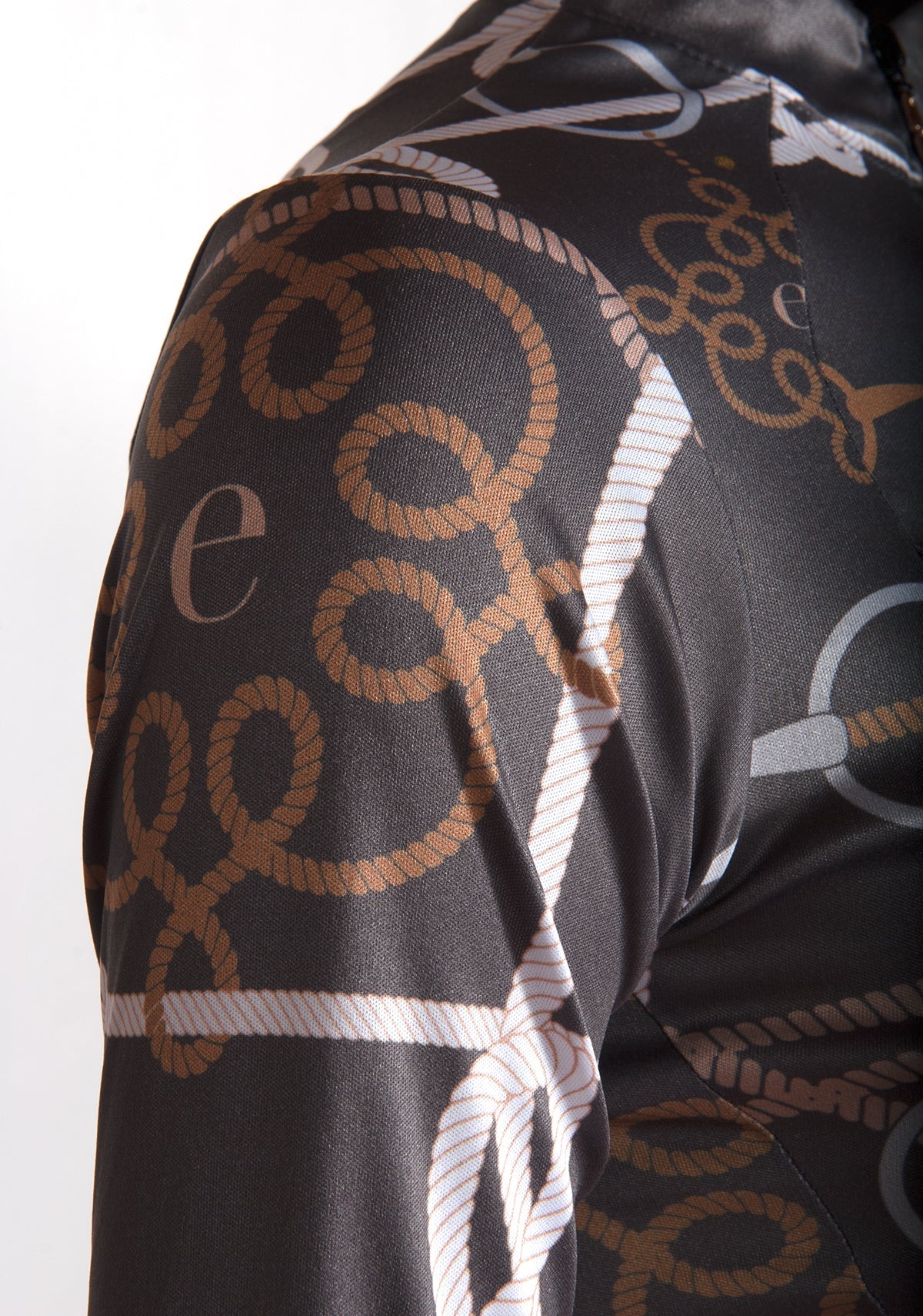 Close-up of a patterned fabric with rope designs on a white background