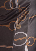 Close-up of a patterned fabric with 'espoir' brand tag, featuring circular and oval shapes.