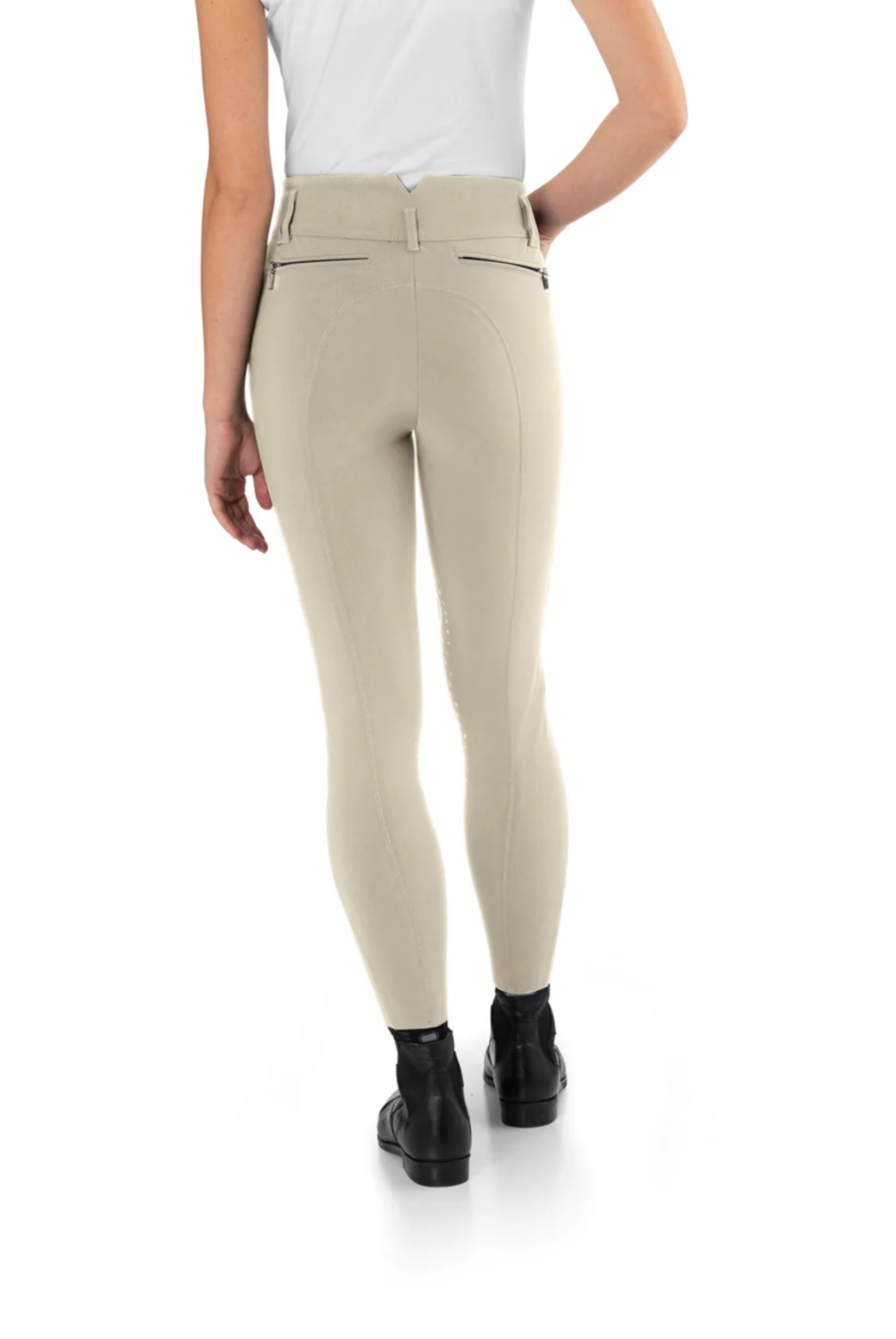 Beige breeches worn by a person on a white background