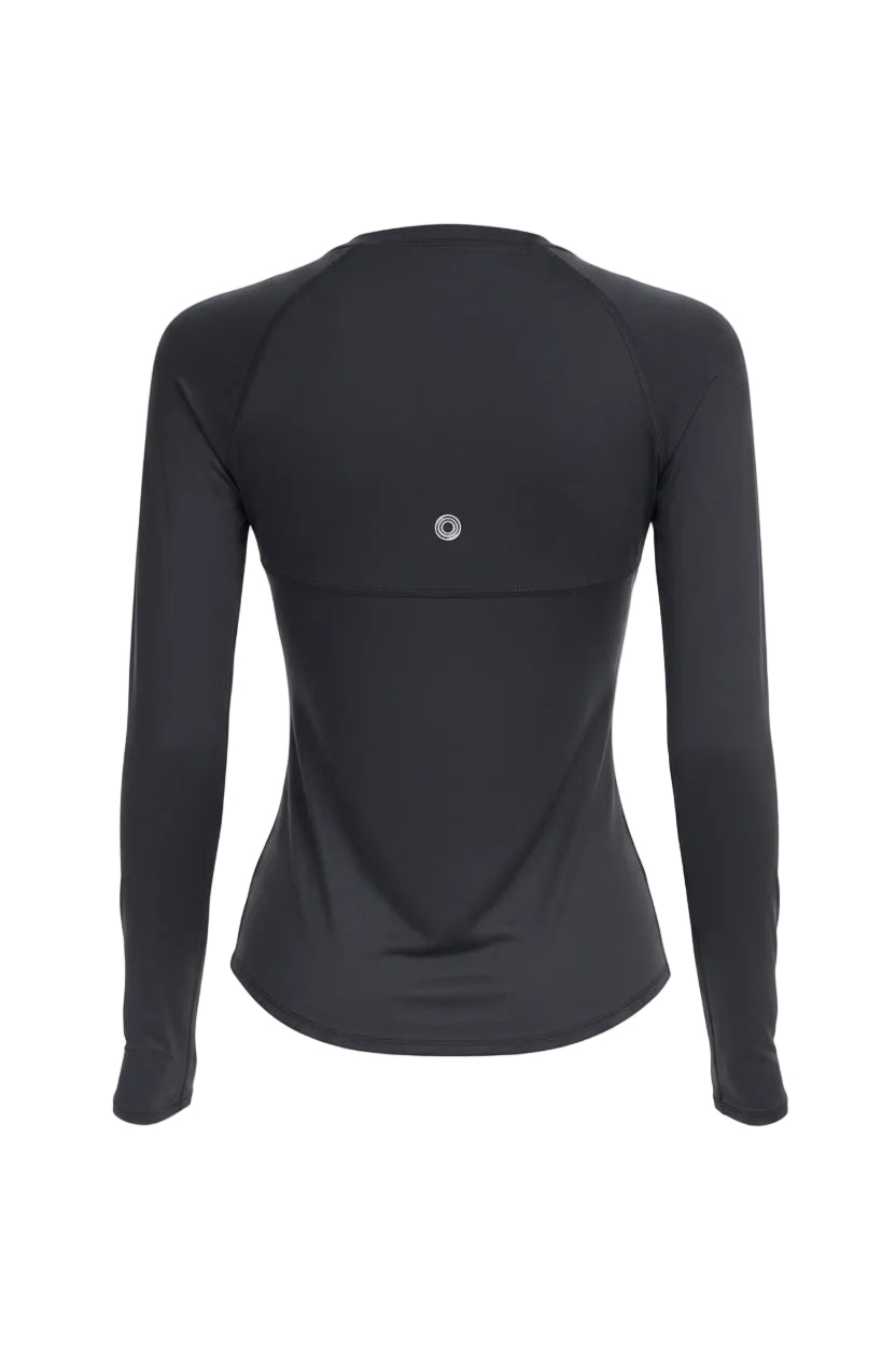 Woman wearing a black long-sleeve athletic top on a white background