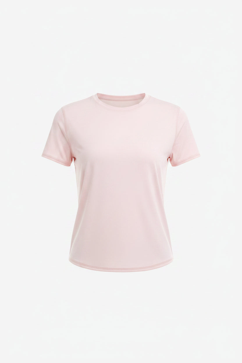 Woman wearing a light pink t-shirt and black skirt on a white background