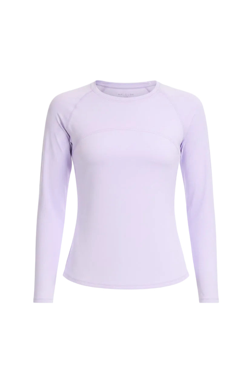 Woman wearing a light purple long-sleeve athletic shirt on a white background