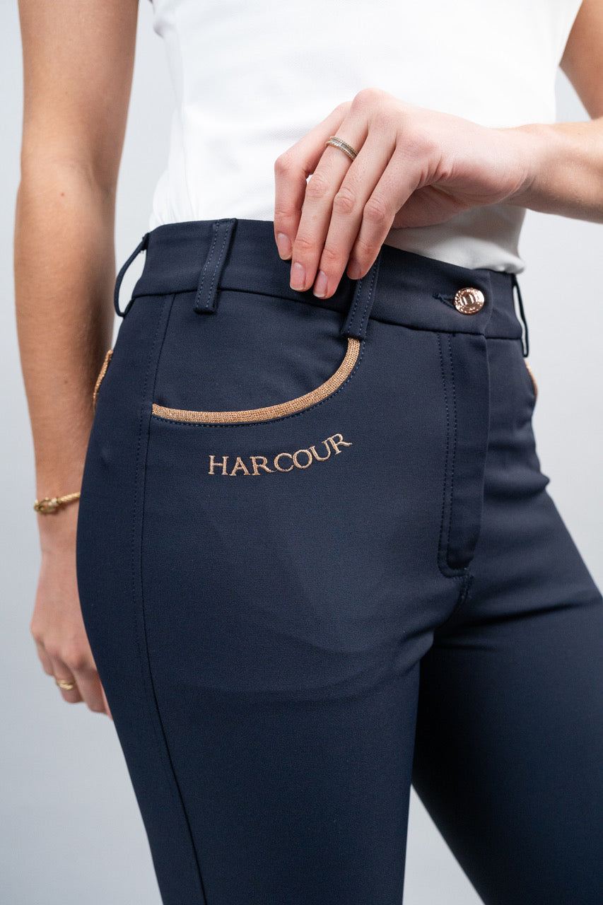 Navy blue equestrian pants with 'Harcour' branding on a white background