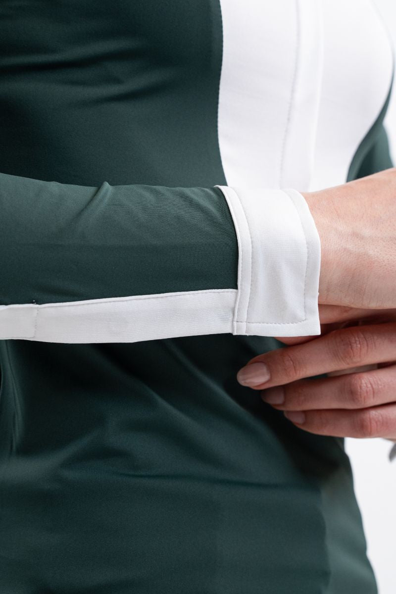 women's green long sleeve equestrian show shirt with white bib, collar, and cuffs.