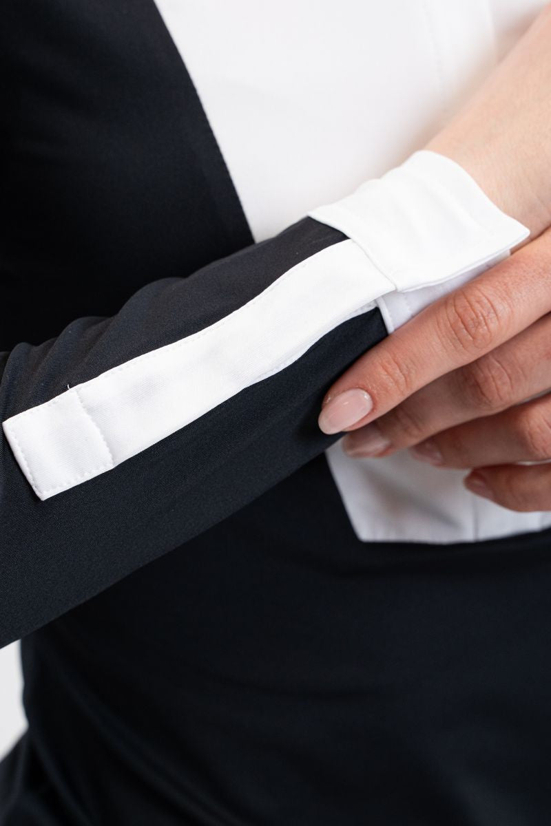 women's black long sleeve equestrian show shirt with white bib, collar, and cuffs.
