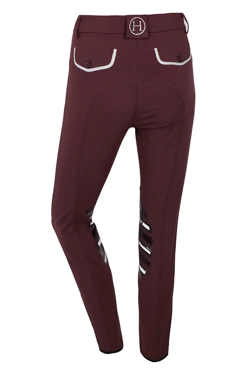 Maroon riding pants with white accents on a white background