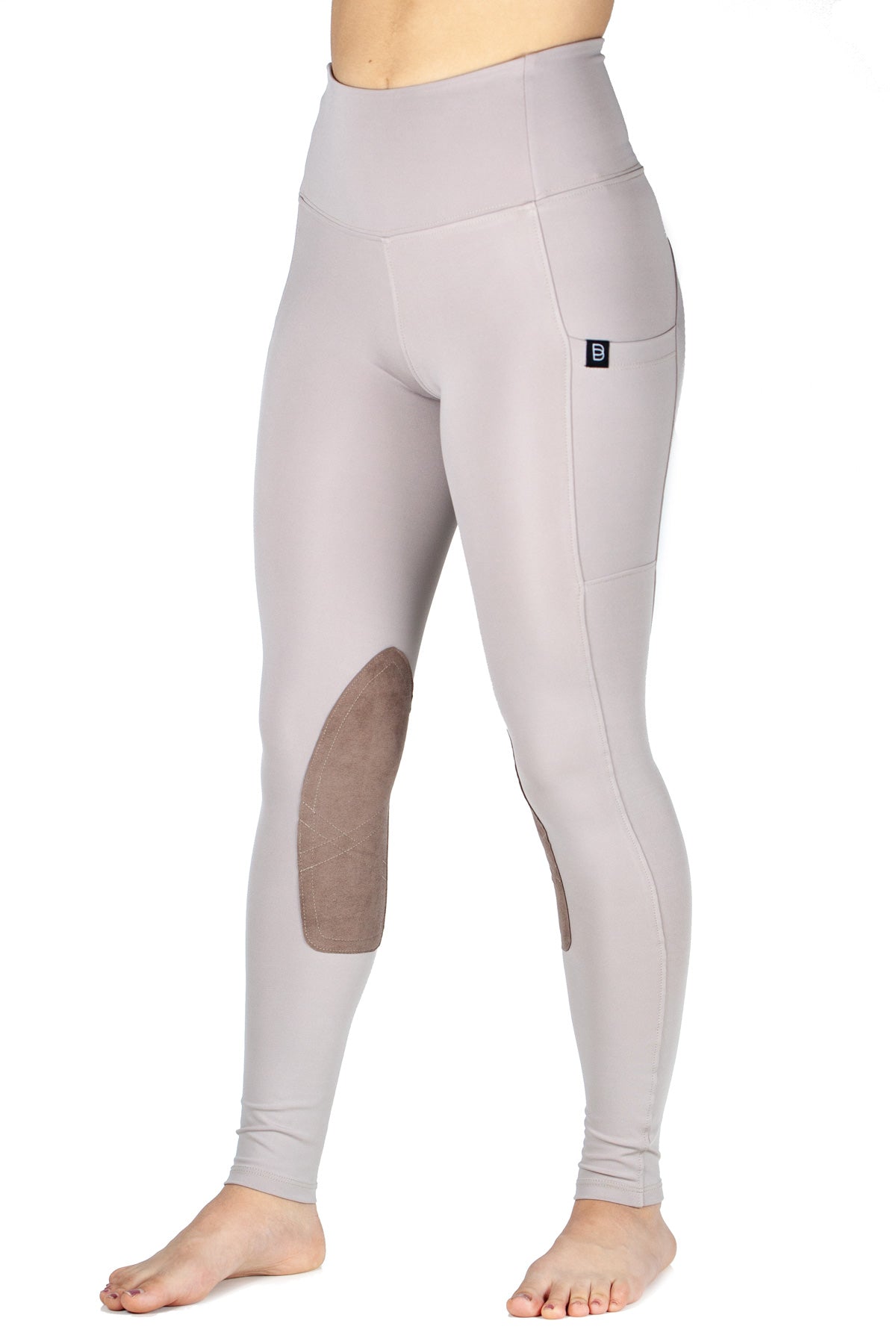 Light gray riding leggings with brown patches on a white background