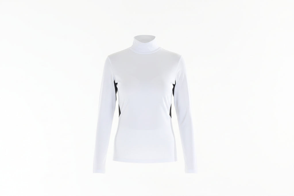 Woman wearing a white long-sleeve top with black accents and white pants on a white background