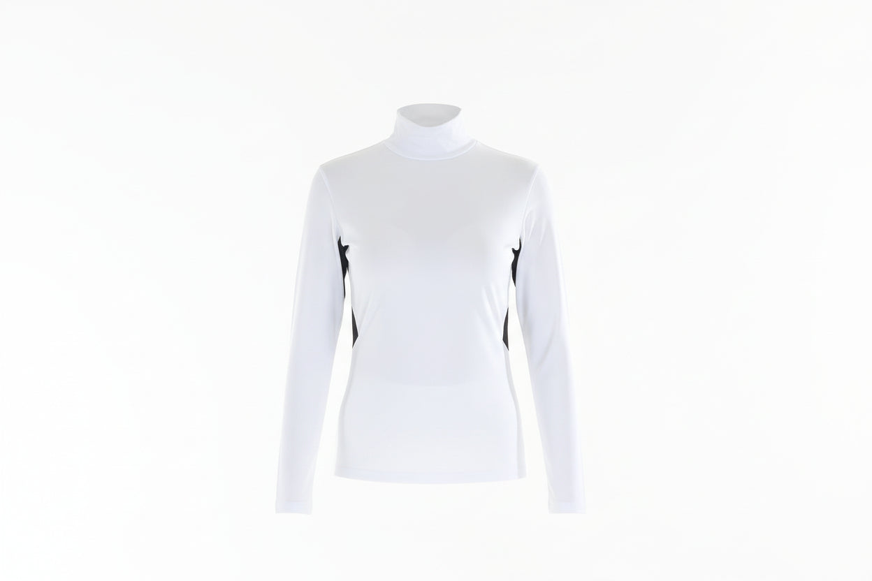 Woman wearing a white long-sleeve top with black accents and white pants on a white background