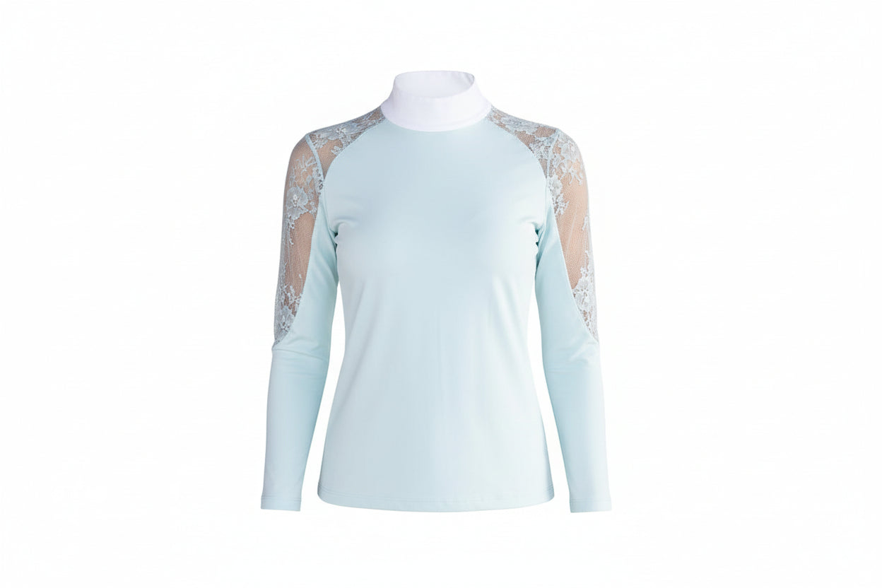 light blue top with lace sleeves and beige pants on a white background