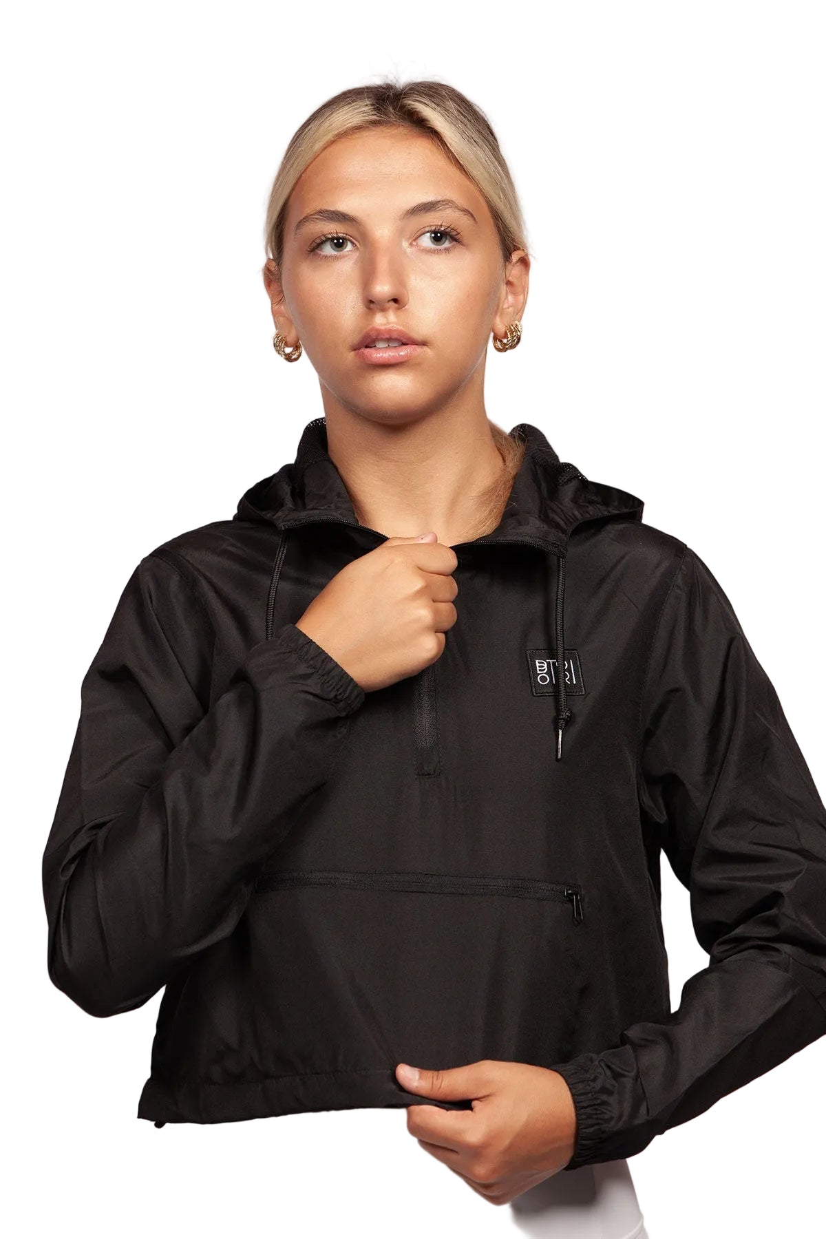 Woman wearing a black jacket with a brand logo on a white background