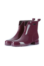 Pair of glossy burgundy rain boots on a white background